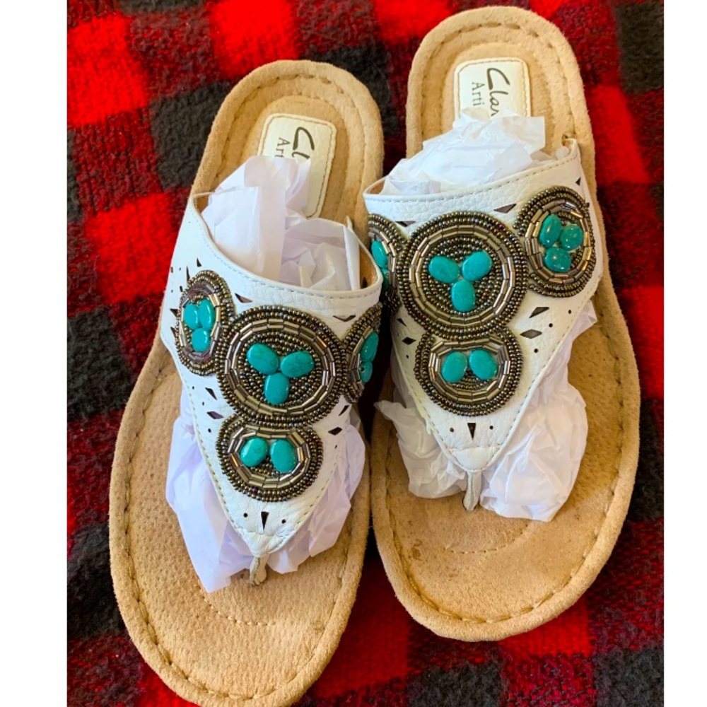 Clarks white thong sandals with “turquoise” stone detailing
